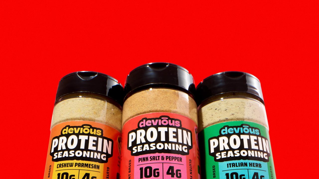 Three jars of Devious protein seasoning in Cashew Parmezan, Pink Salt and Pepper, and Italian Herb flavors